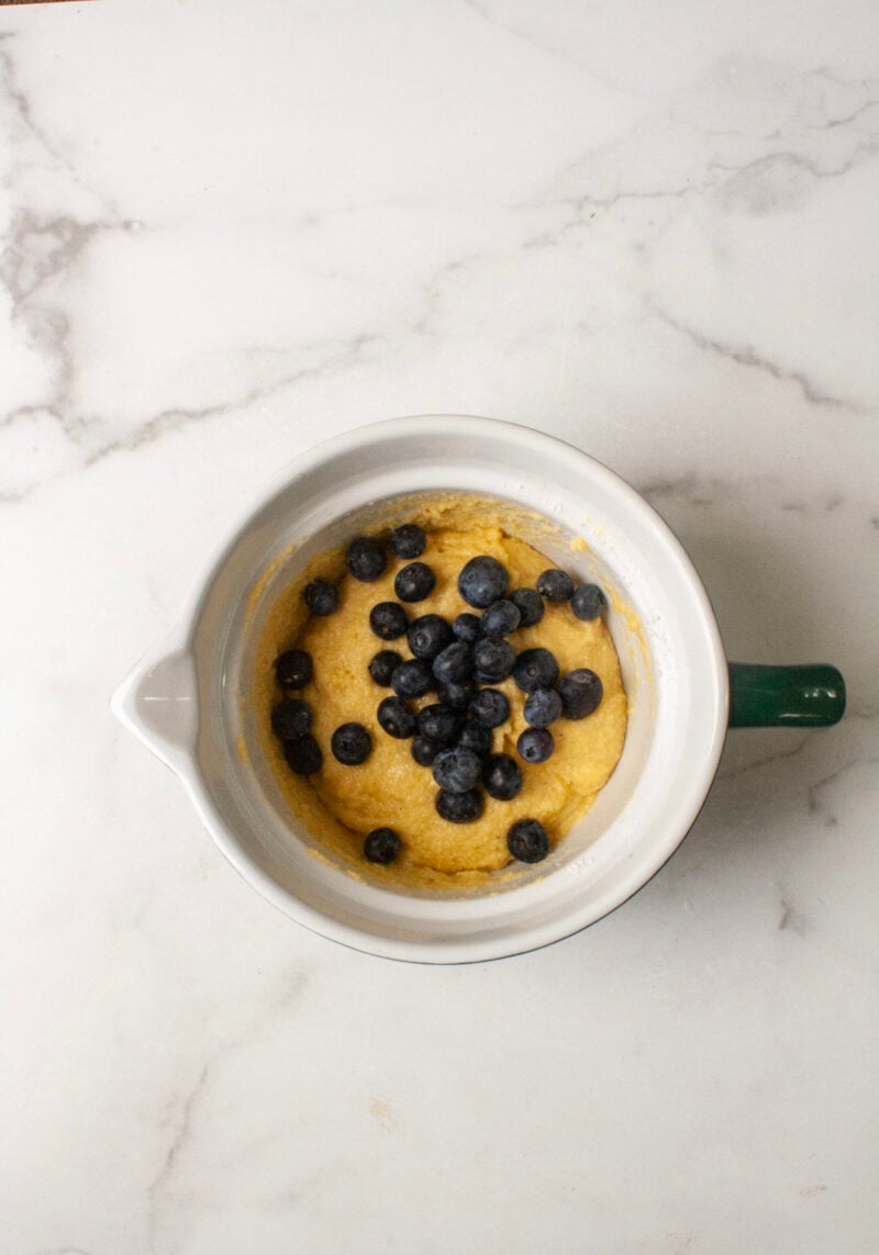 Blueberry batter in mixing bowl.