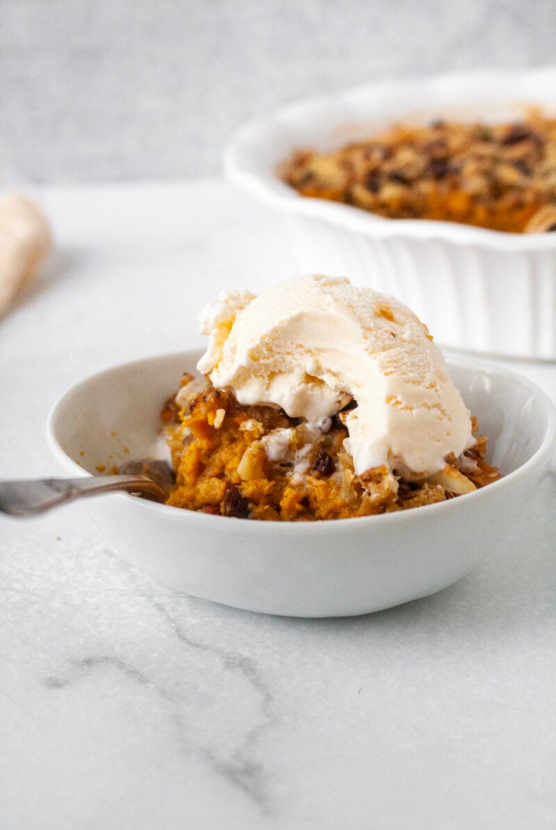 Bowl of orange dessert.