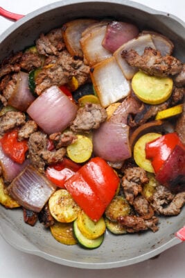 Steak with veggies.