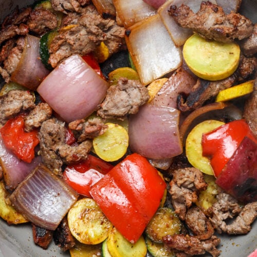 Steak with veggies.