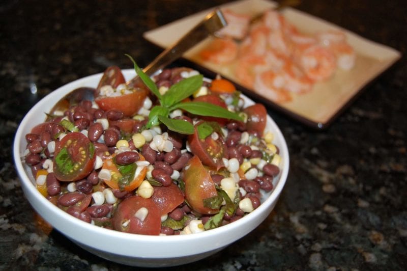 Tomato, corn, and black bean salad in a bowl. 