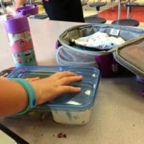 Packing up after eating school lunch