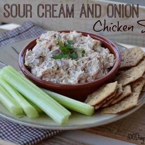 Sour cream and onion chicken salad in a bowl with celery and crackers.