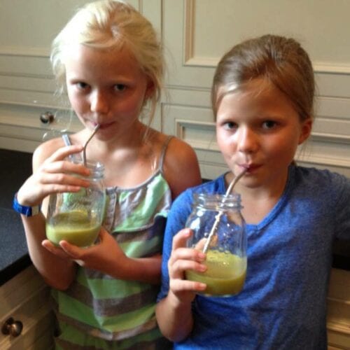 Two sweet girls drinking liquid vitality