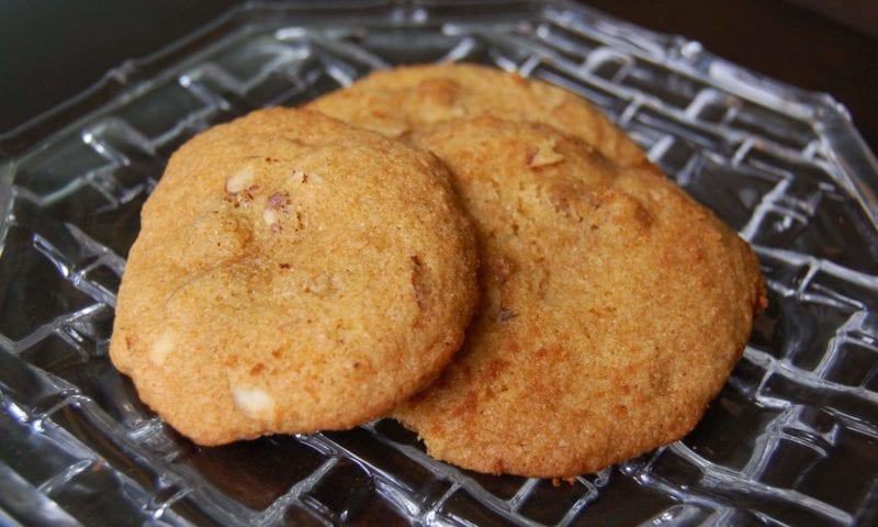 Three honey nut cookies on a plate. 