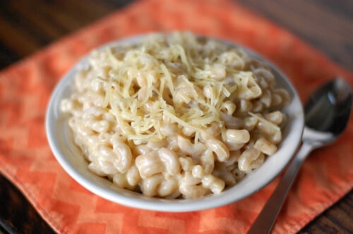 creamy mac and cheese recipe made with whole wheat noodles and cheese in a white bowl