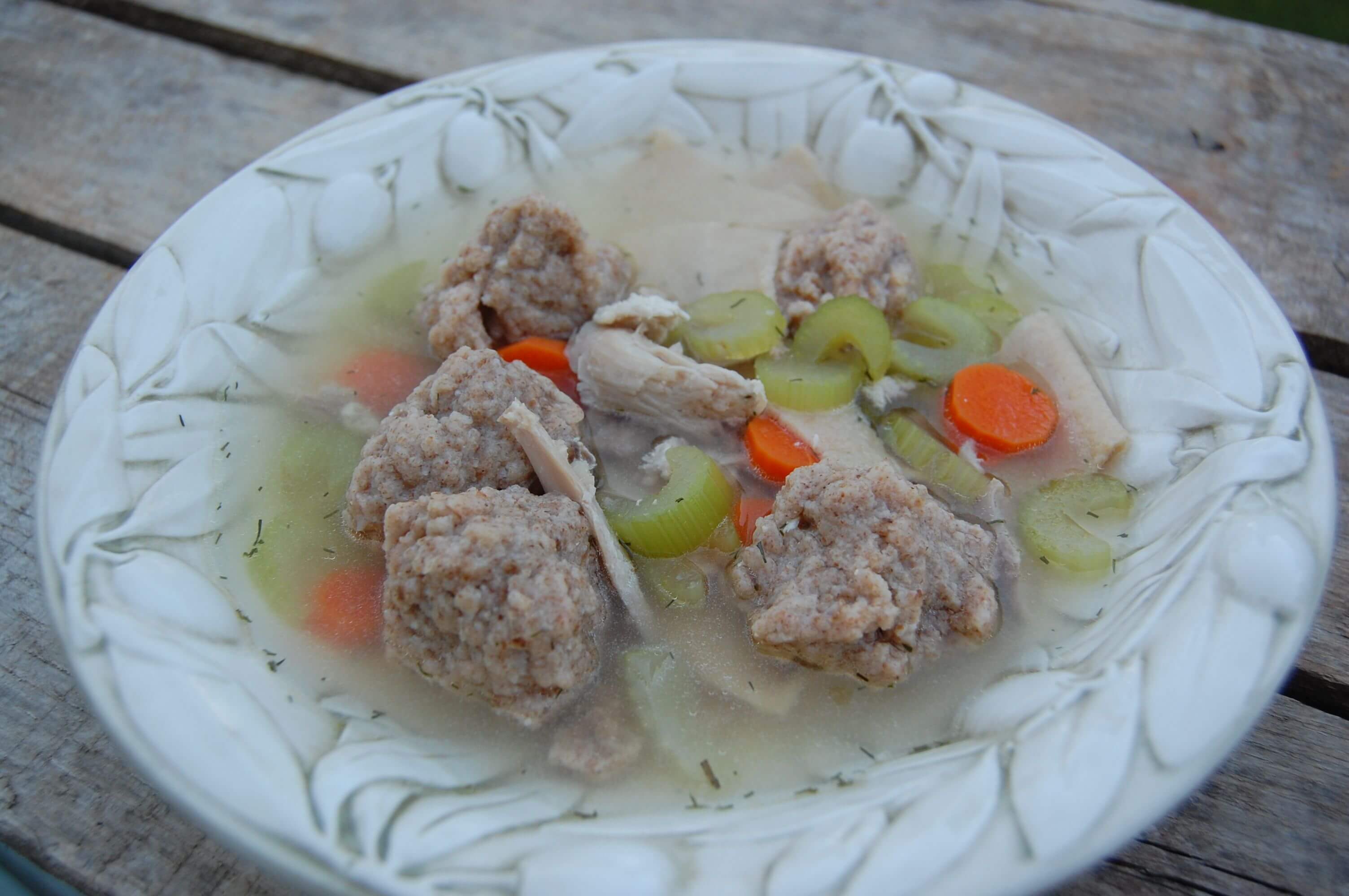 Homemade matzo ball soup in a bowl. 